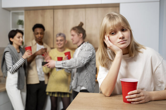 medium-shot-woman-sitting-alone-with-cup